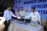 Technical Class license being handed over to OM Ariff VU3ARF by Hamfest India 2013 Organizers.